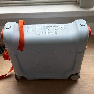 Stokke JetKids Light Blue and Orange Ride-On Suitcase